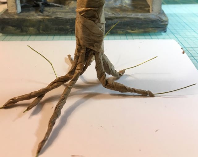 Base of the trunk and roots need more paper wrapping.