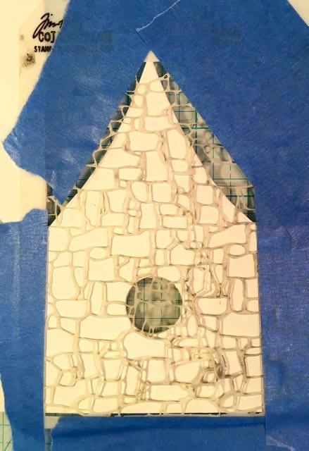 Photo 1. Stencil taped to the cardboard pattern