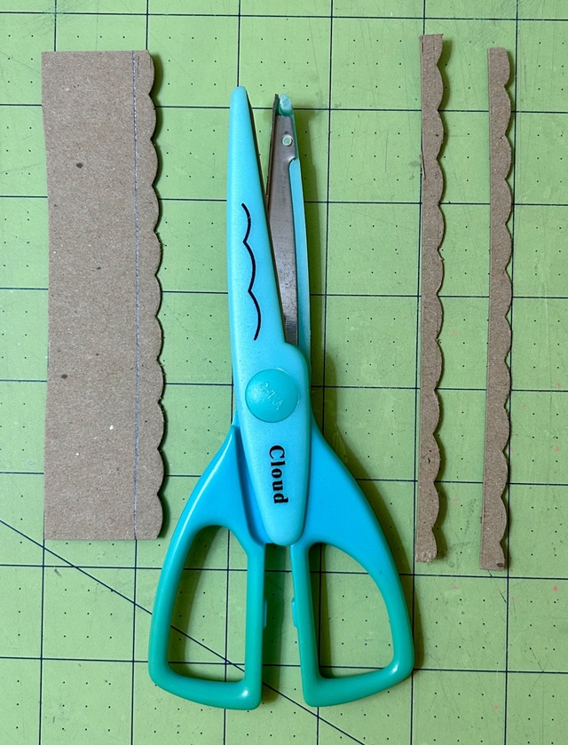 scalloped trim pieces and scrapbooking shears.jpeg