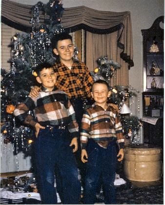 Boys in front of Christmas tree