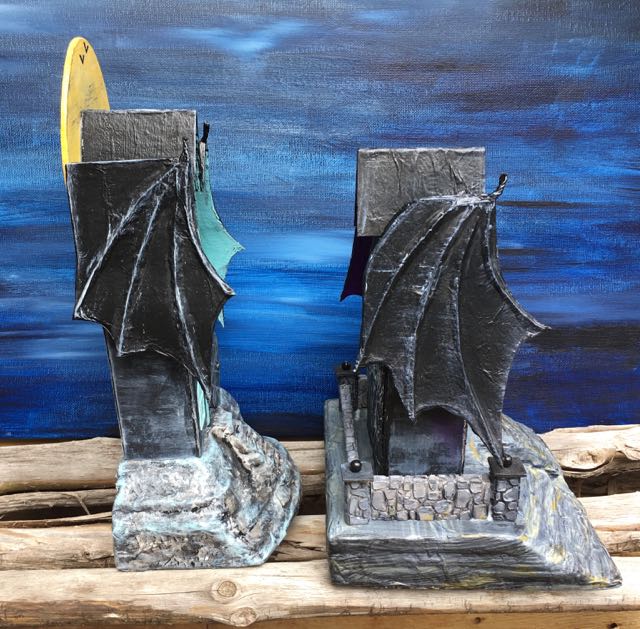 Wing shape. The latest house has a rounded wing shape at the back of the roof.