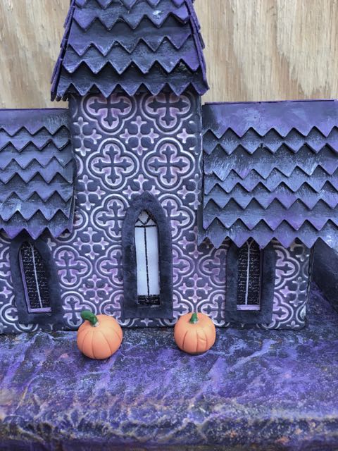 Front view of the purple Tower house. The windows are stamped on plain paper and glued in place.