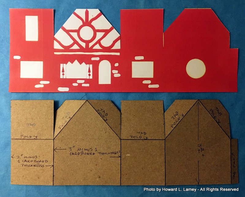 thin cardboard body and printed graphics cut out and ready attaching to the body with glue...the openings for the light hole, door and windows and chimney will be cut after the glue dries...