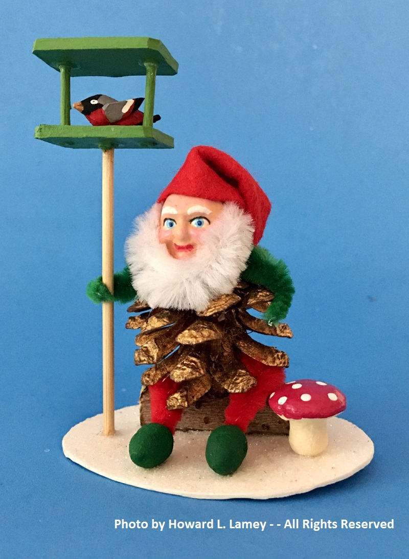 pine cone pixie with bird feeder.jpg