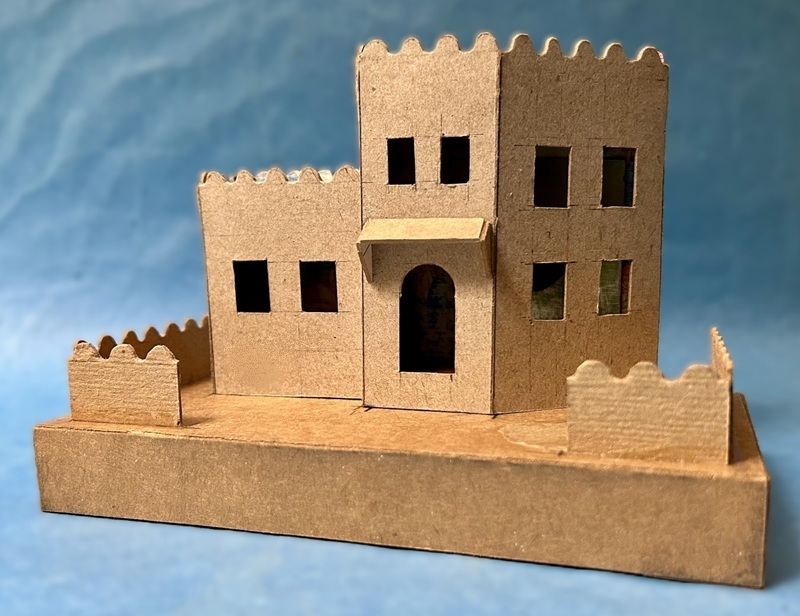 raw cardboard work in progress house with deer.jpeg