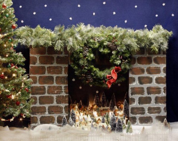 Christmas putz in a fireplace display